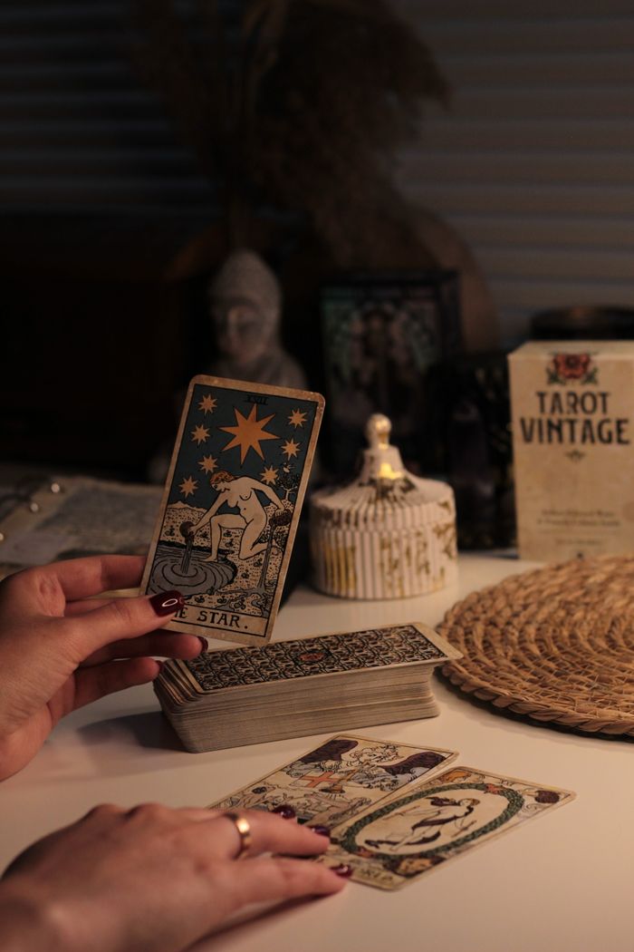 about-03 A cozy room with a vintage tarot reading setup featuring The Star card.
